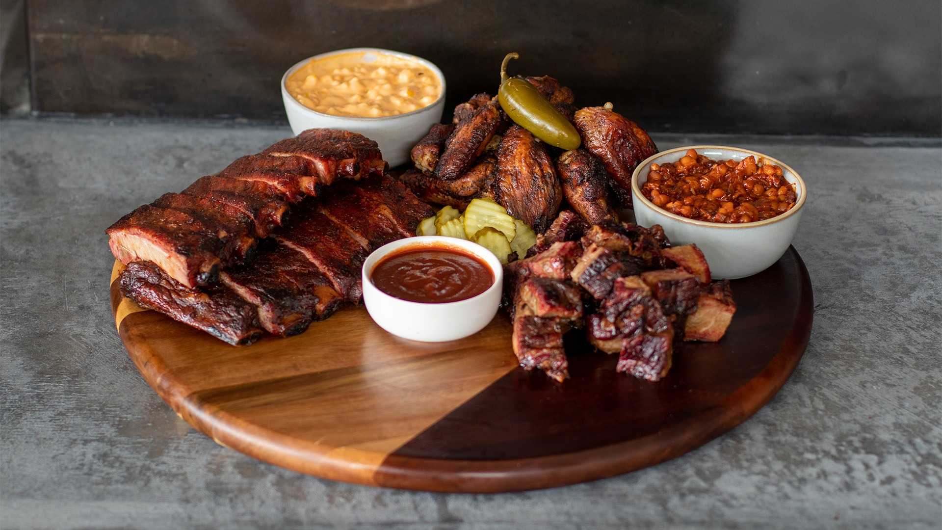 Order SIGNATURE SAMPLER FOR 4 PEOPLE food online from Jack Stack Barbecue - Martin City store, Kansas City on bringmethat.com