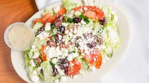 Order Greek Salad food online from Bella Pizzeria - Carmel store, Carmel on bringmethat.com