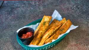 Order Pesto Breadsticks food online from Amici's Kitchen and Living Room store, Berkley on bringmethat.com