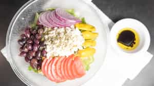 Order Greek Salad food online from Sunset Pizzeria store, Henderson on bringmethat.com