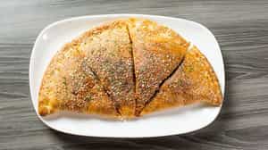Order Calzone food online from Aubree's Pizzeria & Grill store, Ypsilanti on bringmethat.com