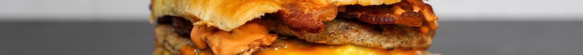 Croissant, Bacon, Sausage, Egg & Cheddar Sandwich