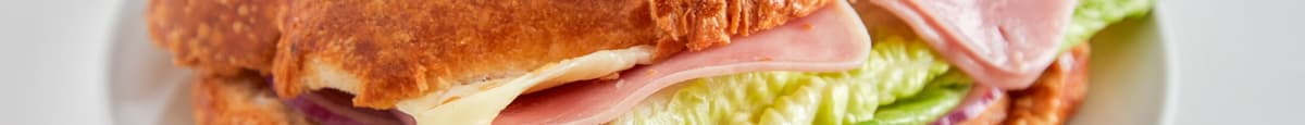 Ham, Cheese, Lettuce, Onions and Tomatoes on Croissant Sandwich
