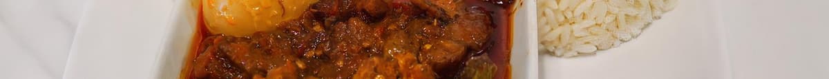 STEAMED RICE, OFADA SAUCE WITH GOAT/COW FEET OR COW SKIN