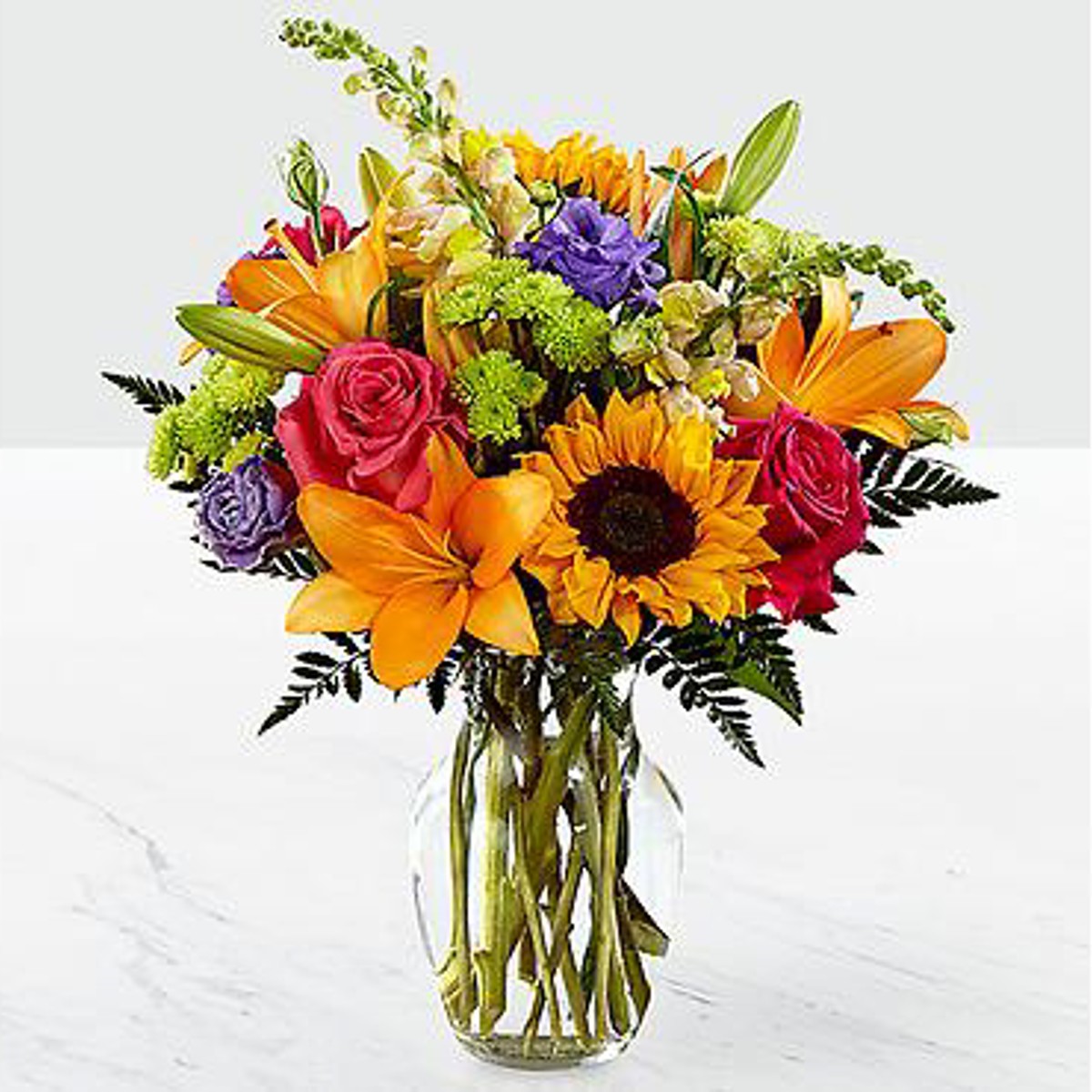 Summer wild flower bouquet including hydrangea, lilies, stock queen anne's  lace, and english ivy.
